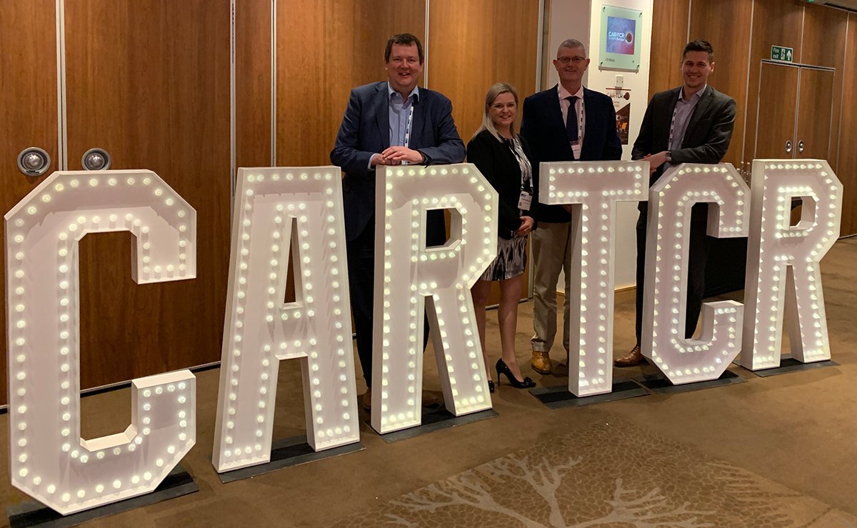 QicSTAT's tweet photo. Martin Lamb from @TrakCel_ (left), Suzanne Bicknell and Adrian Lee-Mohan from QuickSTAT, along with Joseph Durrant (right), also from TrakCel. Stop by and learn more about #QuickSTAT and #TrakCel's integrated #DigitalSupplyChain IT solution for #CellAndGeneTherapies. https://t.co/xwIYGDkJhK