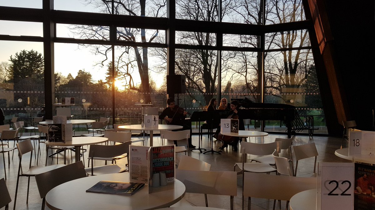 Earlymuso's tweet photo. #Schumann at sunset. @RWCMD #stringstudents in the foyer ending a beautiful day! #pianotrio #conservatoire https://t.co/aYIQhwdt6N