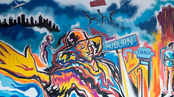 Hyundai's tweet photo. In honor of Black History Month, we dedicated our space at Super Bowl 53 in Atlanta to celebrate Auburn Avenue’s place in African American history. We commissioned @clow2ground to create a mural to be the backdrop for talks w/local leaders about community &amp; more. #BHM https://t.co/KJ4iAeN5TW