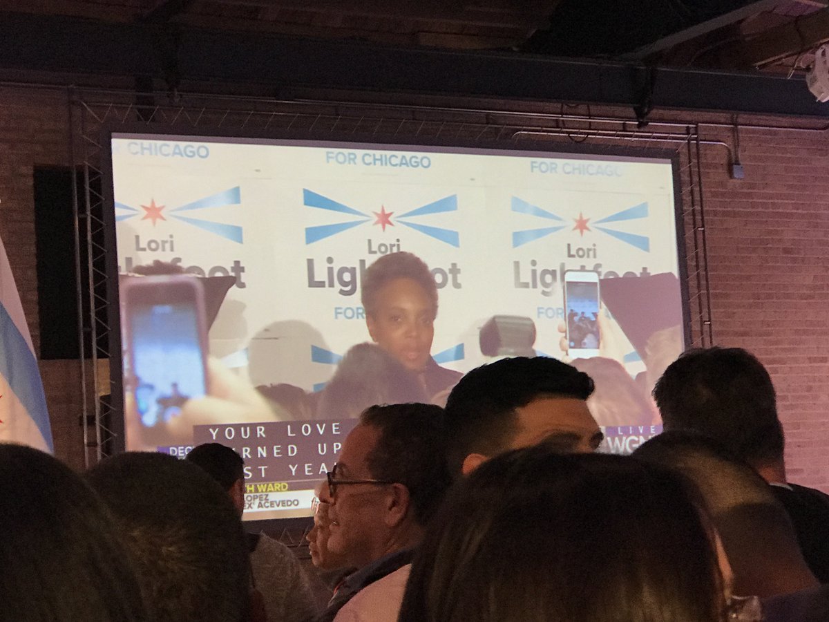 JimGudas's tweet photo. At Bill Daley headquarters at Venue West, the mood remains upbeat and few people seem to pay attention as giant TV screens show Lori Lightfoot addressing her supporters. The mood here remains upbeat. You can get the latest results @wbbmnewsradio and https://t.co/HdXDuVRLNI. https://t.co/YMcWVdbV0m