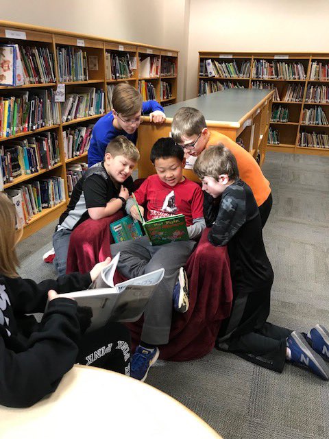 This picture is not staged...totally candid.  The book title is, "Not Fair, Won't Share!"<a href="/EEZCS/">Eagle Elementary</a>