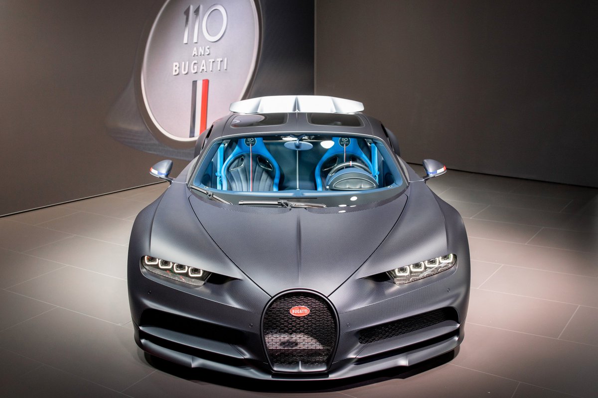 Bugatti's tweet photo. The Chiron Sport ‘110 Ans Bugatti’ presents itself to the public. Its unique colour combination of exposed carbon fibre and matt Steel Blue is receiving a lot of applause. #Bugatti #BugattiChiron #ChironSport #ChironSkyview #Bugatti110Years #Bugatti110Ans #GIMSSwiss https://t.co/kaR9rNuSmF