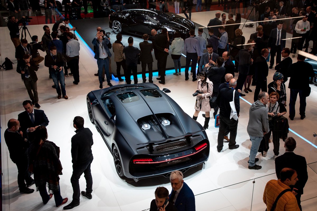 Bugatti's tweet photo. The Chiron Sport ‘110 Ans Bugatti’ presents itself to the public. Its unique colour combination of exposed carbon fibre and matt Steel Blue is receiving a lot of applause. #Bugatti #BugattiChiron #ChironSport #ChironSkyview #Bugatti110Years #Bugatti110Ans #GIMSSwiss https://t.co/kaR9rNuSmF