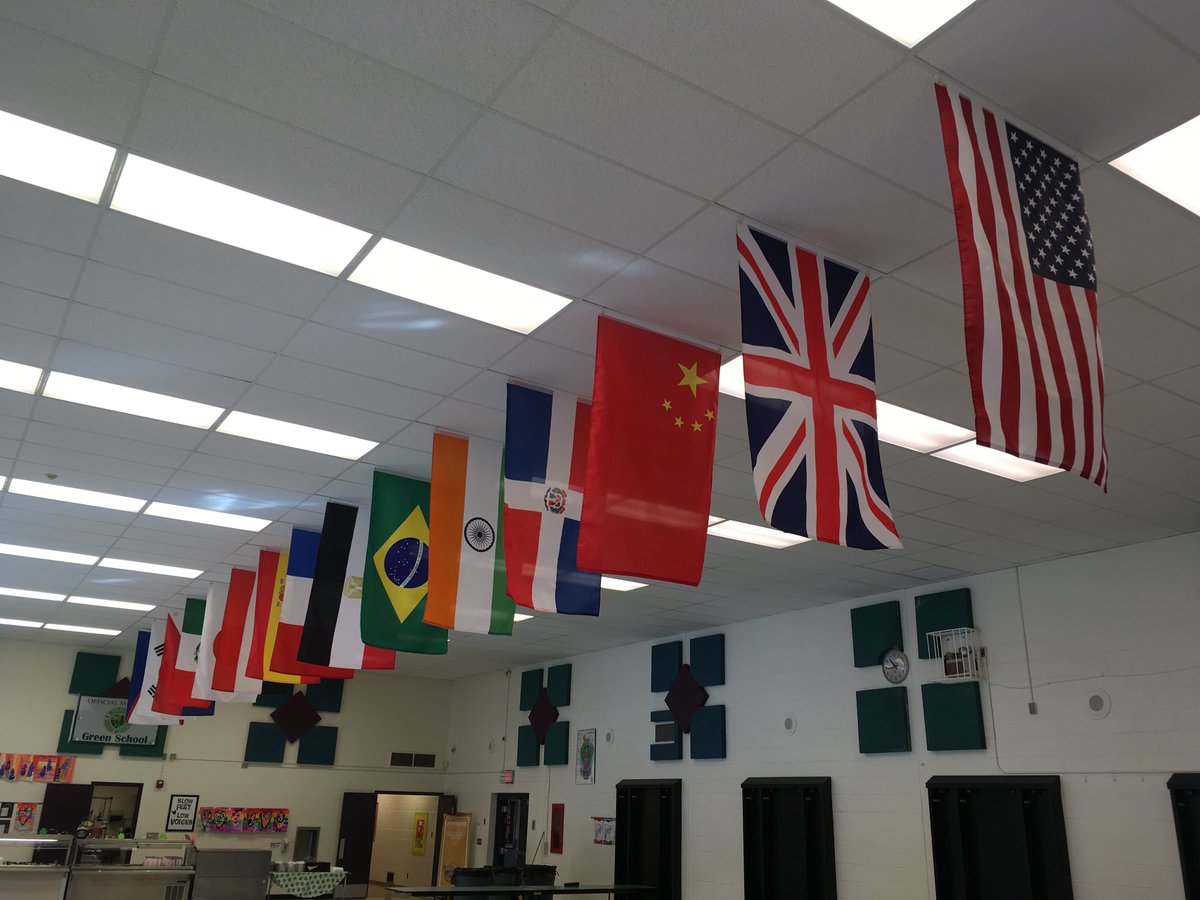 NoviOrchardHill's tweet photo. Orchard Hills has some new additions to the cafeteria!  Thank you to our PTO for starting off our international flag display to recognize our #OHFamily and to our maintenance staff Annesley and Ted for putting them up! #NoviPride https://t.co/qeqzTjgQYG