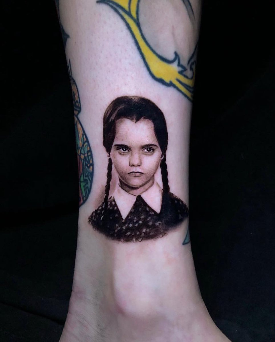 Amazing Wednesday Addams micro portrait tattoo by @PonyLawson of