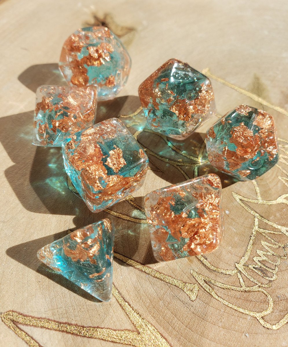 This rose gold flake is EVERYTHING! This set is so beautiful, what would you name it? #dnd #dungeonsanddragons #ttrpg #dice #handmadedice