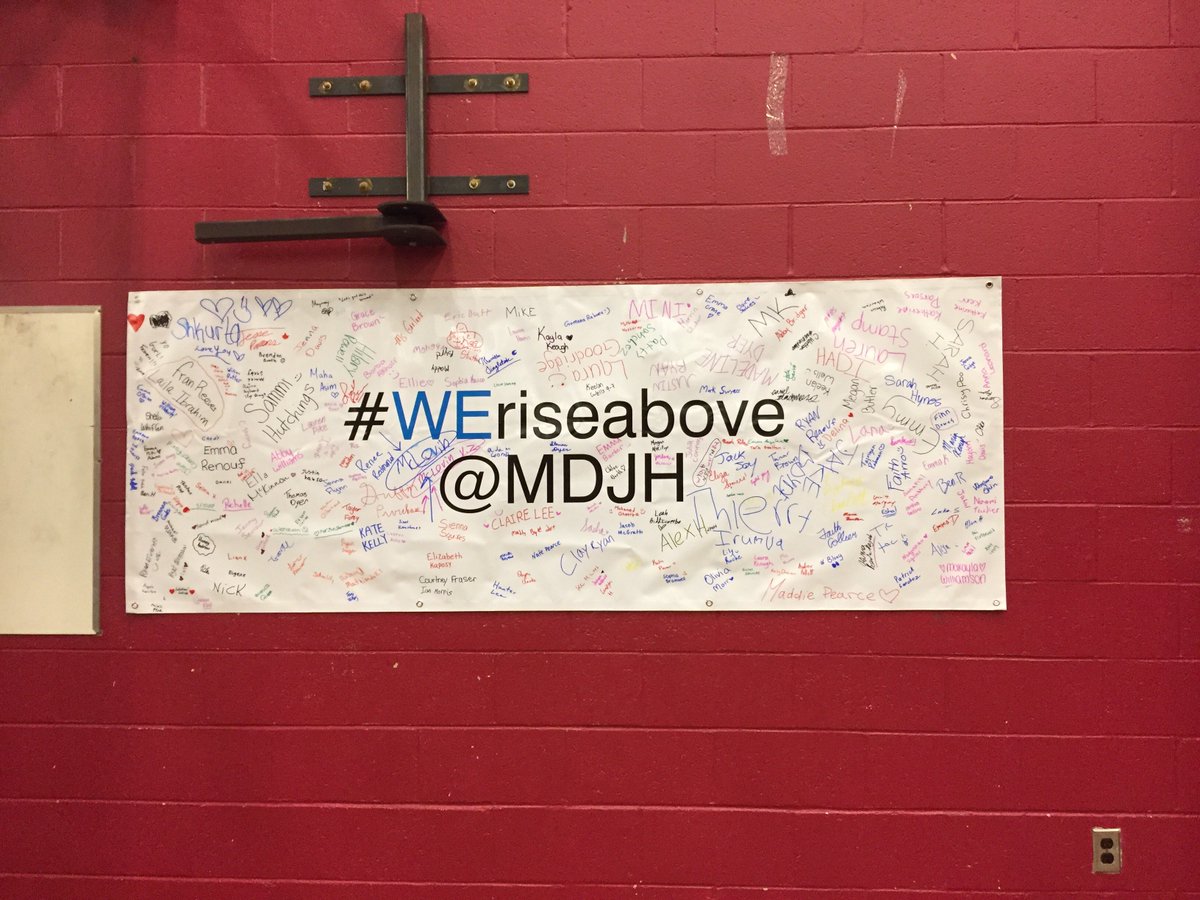 MDJH students have signed the #WERiseAbove banner as part of #PinkShirtDay2019