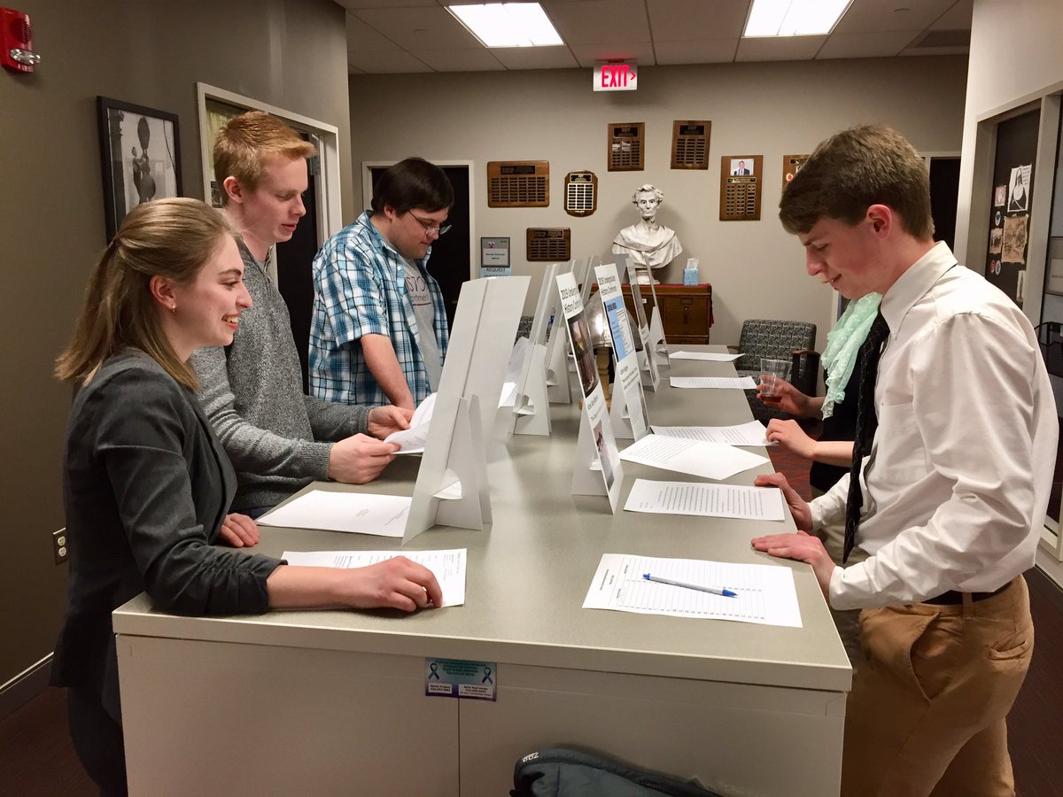 IUPHistory's tweet photo. Students looking through the papers of their peers. https://t.co/wmedFrANtd