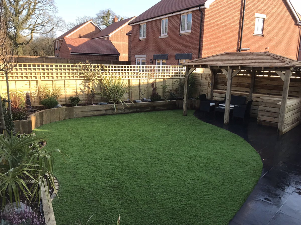 BuckinghamsLand's tweet image. From a mud patch to this beautiful garden. Limestone paving, artificial turf, raised sleeper beds and a bar area ready for any summer party. A full garden makeover with just the lighting and hot tub to finish off #hardlandscaping #patios #paving