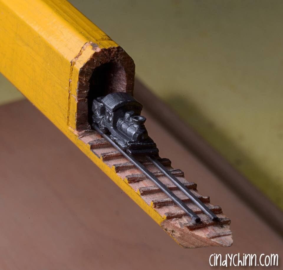 Here is a train carved into the lead of a Carpenters pencil  3/16th of an inch high  by Cindy Chinn.   Wow.
