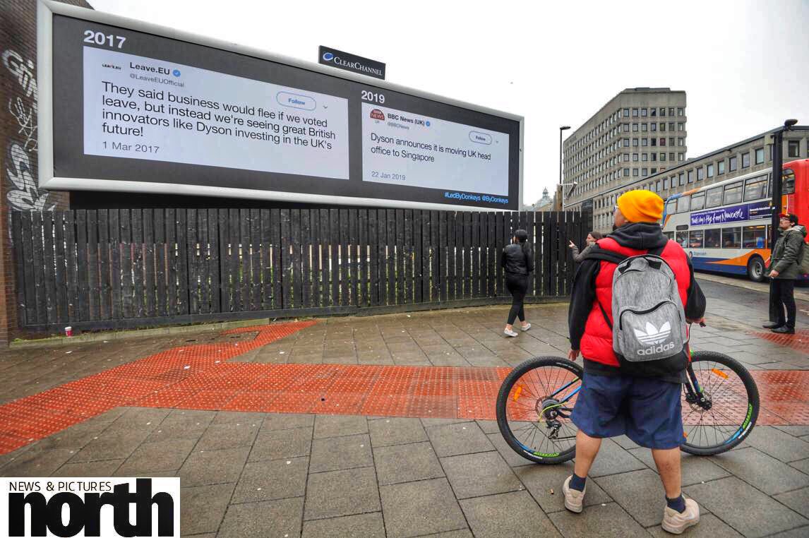 RaoulDixonNNP's tweet photo. Huge billboard in Newcastle city centre mocking Dyson’s decision to move HQ to Singapore after Brexit. @ByDonkeys #Brexit #LedbyDonkeys  #Newcastle https://t.co/WcZlLFwsH0