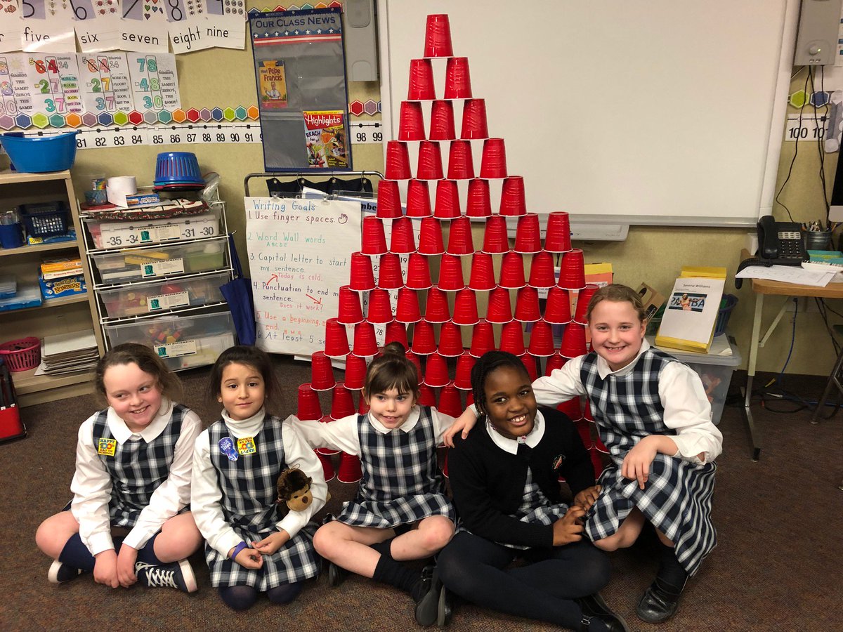 ancillaemath's tweet photo. @AncillaeAssumpt Students in second grade counted out and stacked 100 cups to celebrate the 100th Day of School. #journeyingtogetheraaa https://t.co/t5Iua4gD83