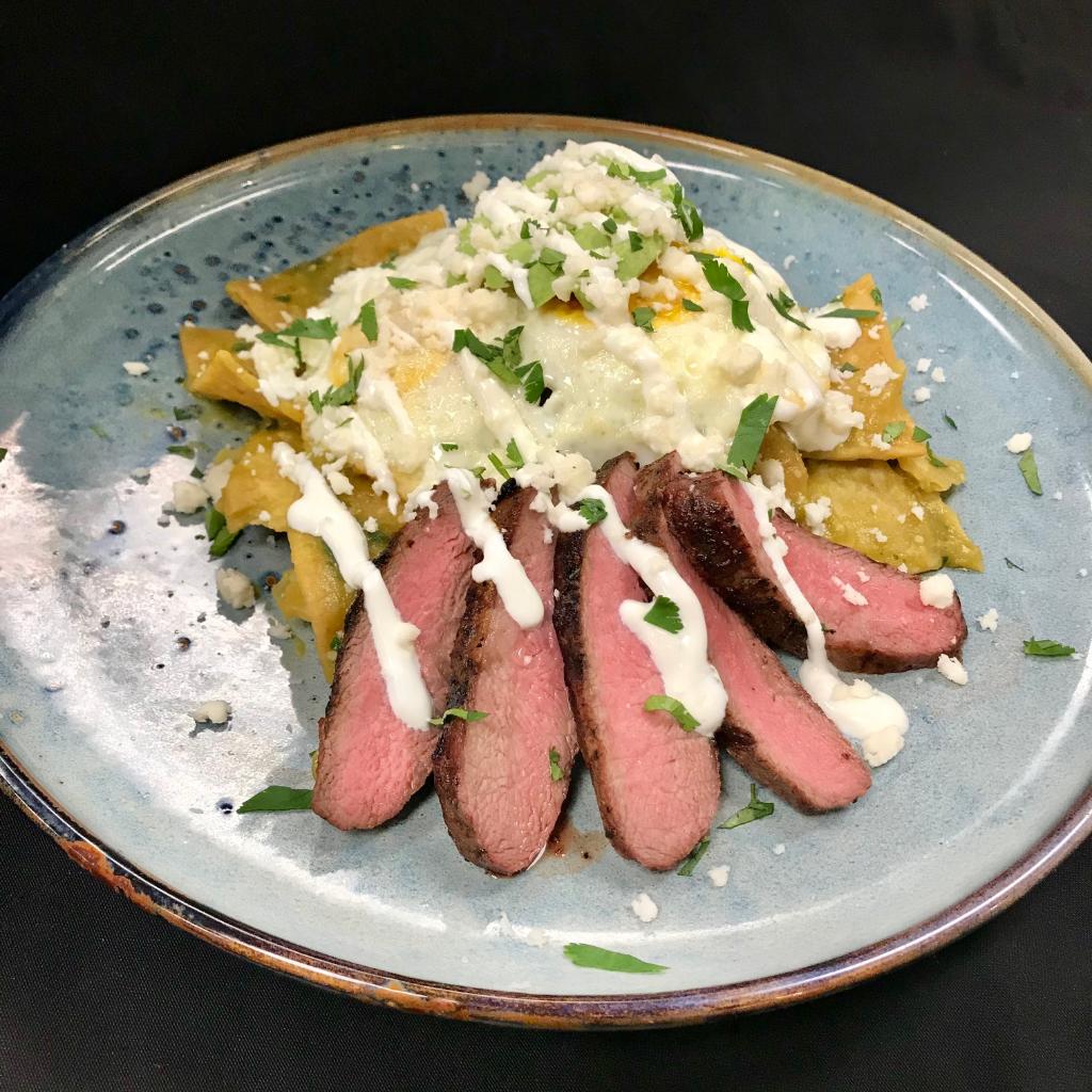 Wow take a look at Chef Rovin's newest Breakfast Special! #Chilaquiles with #Salsa #Verde &amp; #Grilled #FlatIron #Steak- #Eggs, #Avocado, #LimeCreme, #QuesoFresco &amp; #Cilantro with #Greenonions all on a #fried #CornTortilla