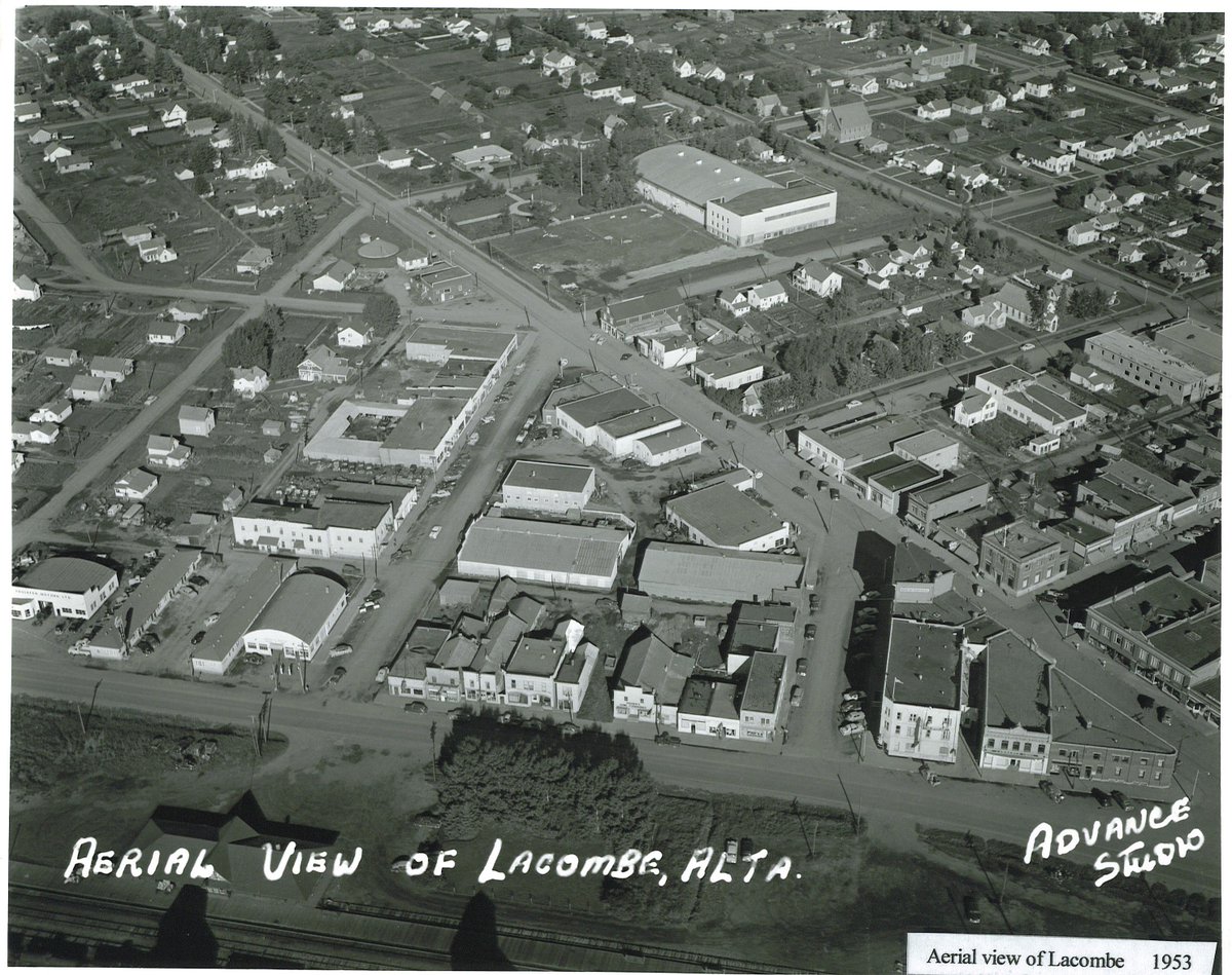 #throwbackthursday to 1953! This aerial photo shows downtown Lacombe. Barnett Avenue (50th Ave) runs through the middle of the photo. The Lacombe Memorial Recreation Centre and Arena sit in the middle. The building burnt down in a fire a few months after this photo was taken.