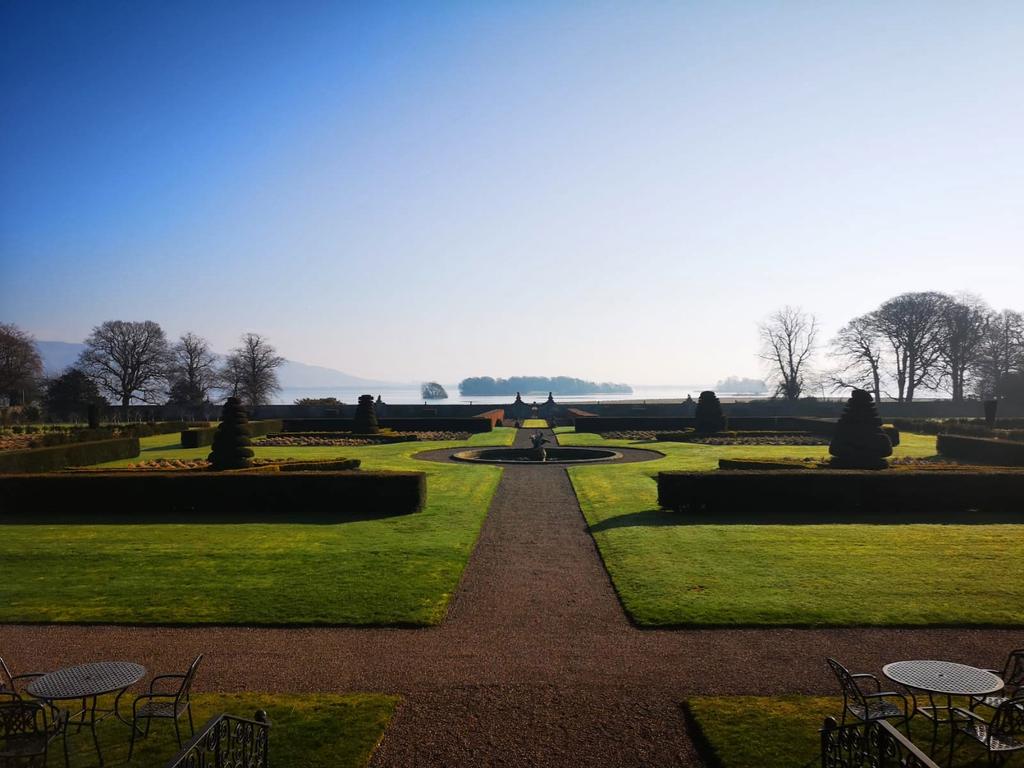 ultravilla's tweet photo. Early spring days are well-spent in #Scotland. These gardens &amp; the gorgeous view belong to #KinrossHouse in the Borders. 
See #LochLeven in the distance &amp; the castle where #MaryQueenofScots was kept prisoner! From @LTRbespoke #scottishmansion #ukexpert #ultradestination #spring https://t.co/jLbWlVoNWO