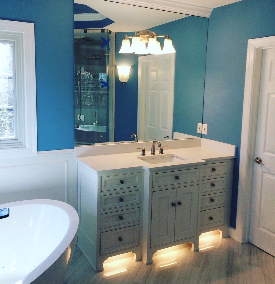 Custom fit mirror over bathroom vanity.