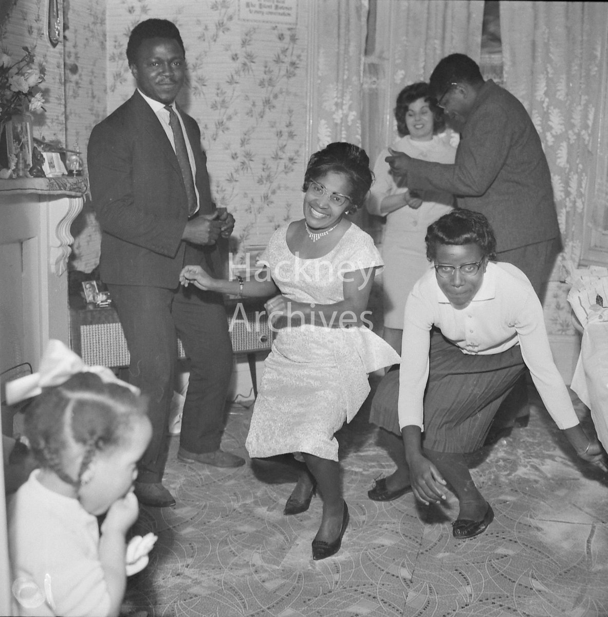 A radiogram was central for family gatherings and ‘blues parties’. 
This photograph from <a href="/ArchivesHackney/">Hackney Archives</a> shows the Alfe family in Hackney enjoying the music from their radiogram during a birthday celebration. 

Learn more @ the #RootsRhythmsRecords exhibition!
