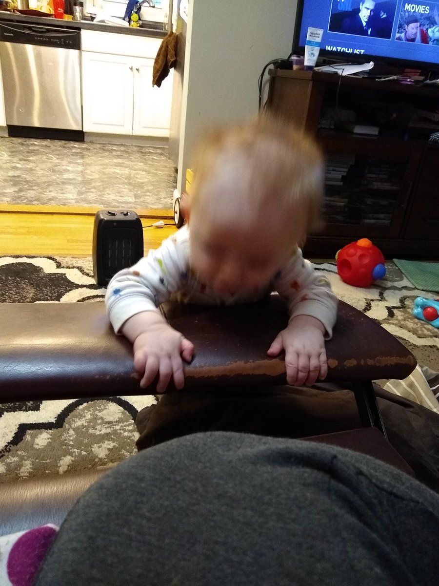 I know it's blurry, but welcome to my son... Always moving. I just love how babies are natural born scientist. His ball "disappeared" through the crack, now he keeps looking through it to figure out way. #MadScientist #AgeOfDiscovery