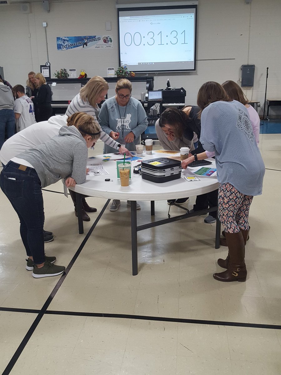 Holmes staff starting out our institute day with a cooperative Breakout EDU teambuilder. #D60learns