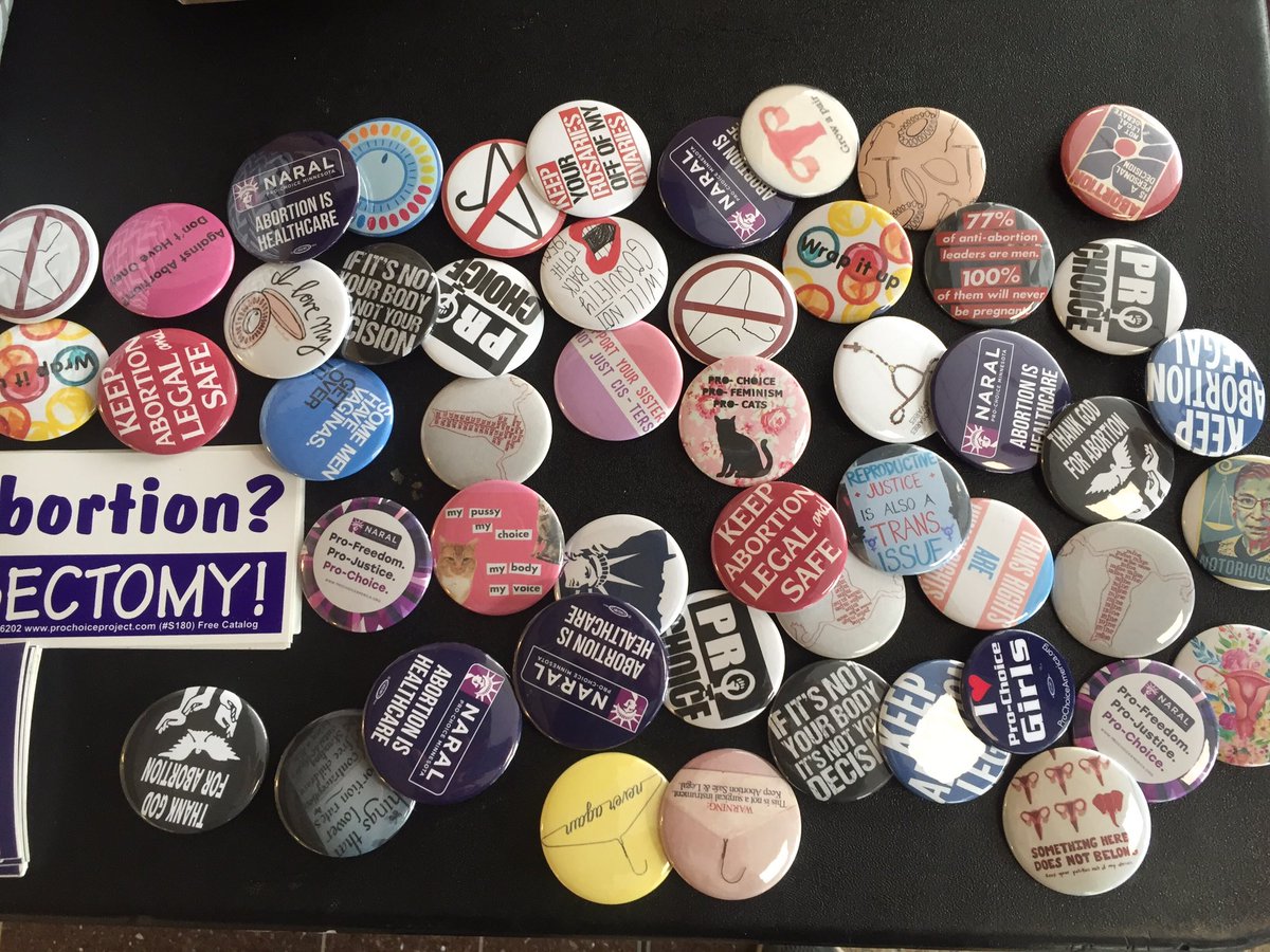Stop by our table today (and every Friday) for new buttons, stickers, candy, condoms, and resources!