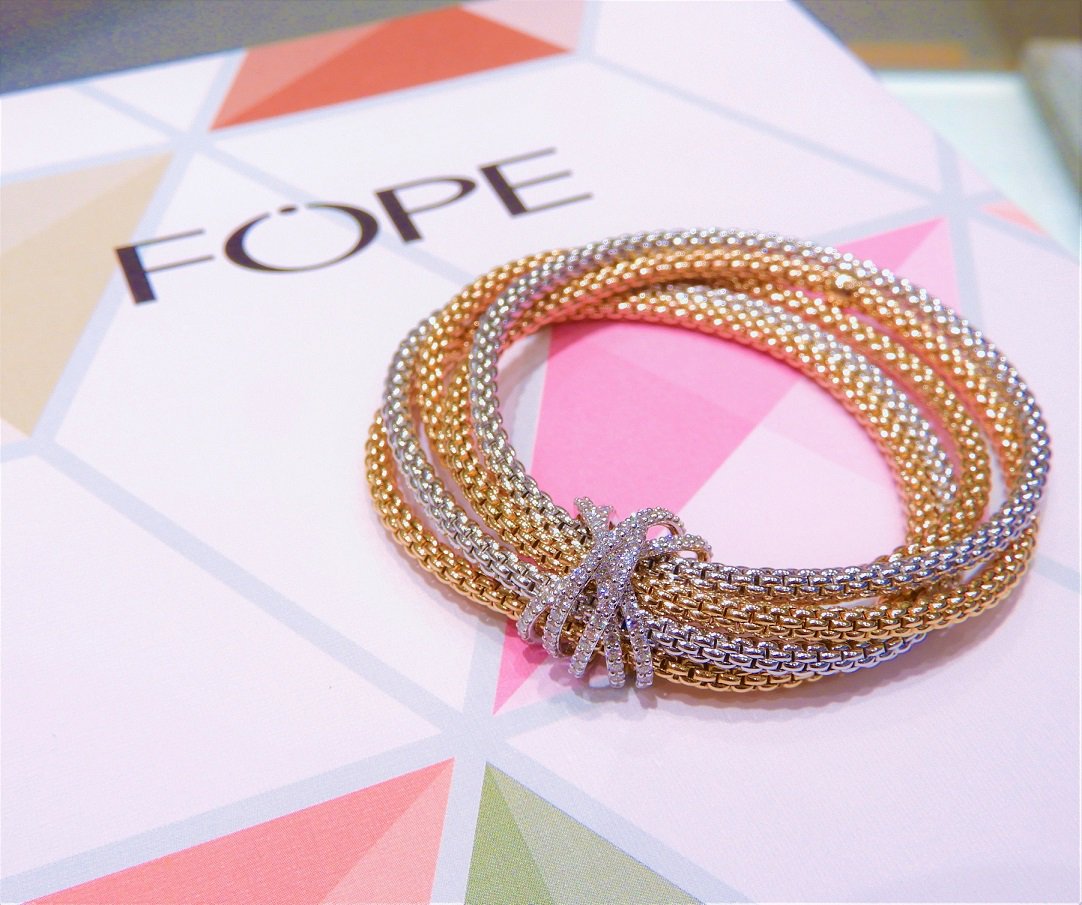 What if your stacking bracelets all came together in one bundle wrapped up in diamonds?  That's Fope of Italy for you!