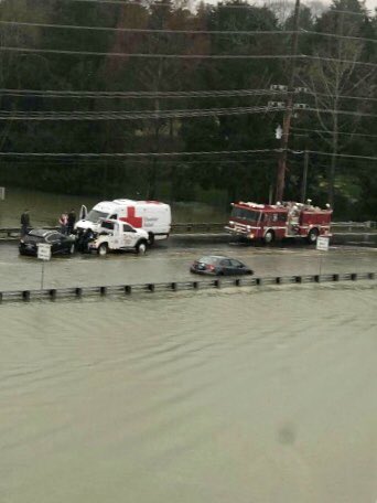 Knoxville_PD's tweet photo. PLEASE stop driving around barricades and road closed signs, they are there for a reason. Your safety and the safety of First Responders shouldn’t be at risk because you don’t want to detour. These vehicles just got stuck in water on Northshore Drive at Town Center Boulevard. https://t.co/saQh5QdxRM