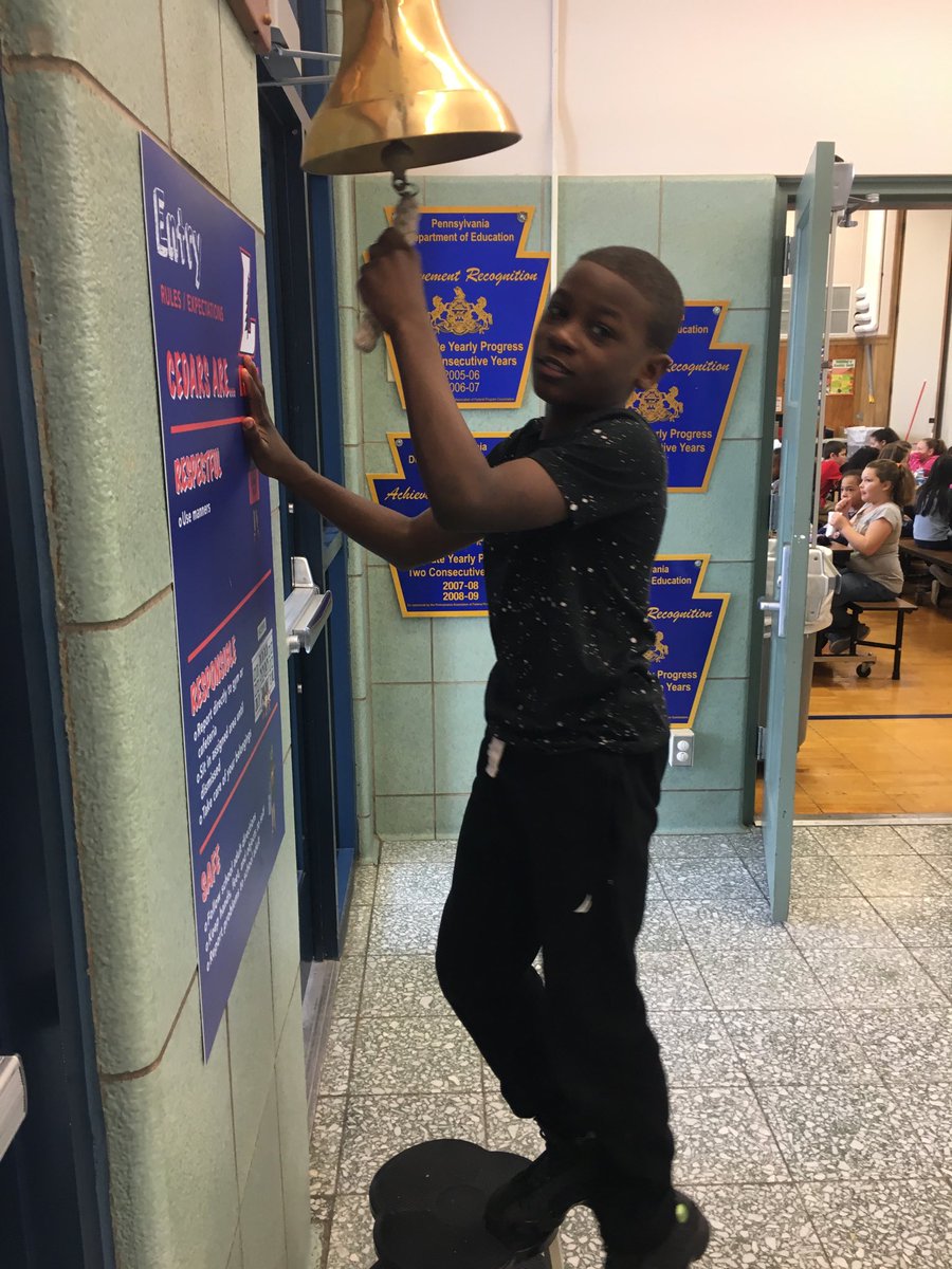 Xavier Baker from SW rings celebration bell for earning PBIS reward!