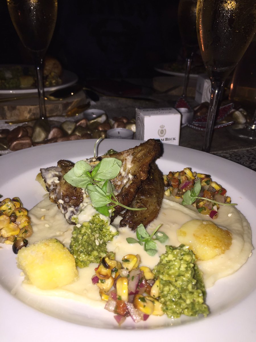 Loyiso's tweet photo. This lamb neh...excuse me for not speaking chef’s language...but jonga...Sesame crusted moroccan lamb cutlets...#lungiscorner #grahambeck #30onmarriot #5coursedinner https://t.co/xUZdZoVQ4e