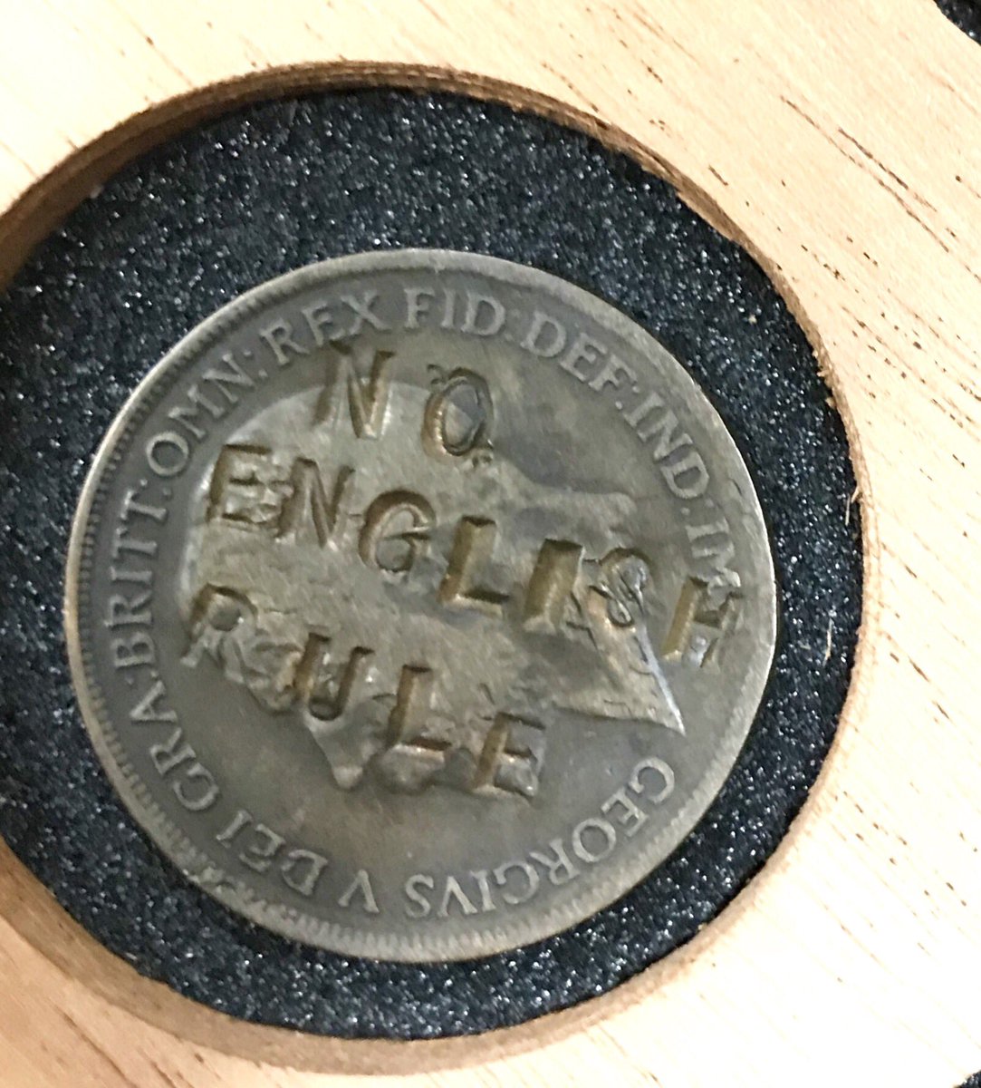 A George V penny countermarked NO ENGLISH RULE