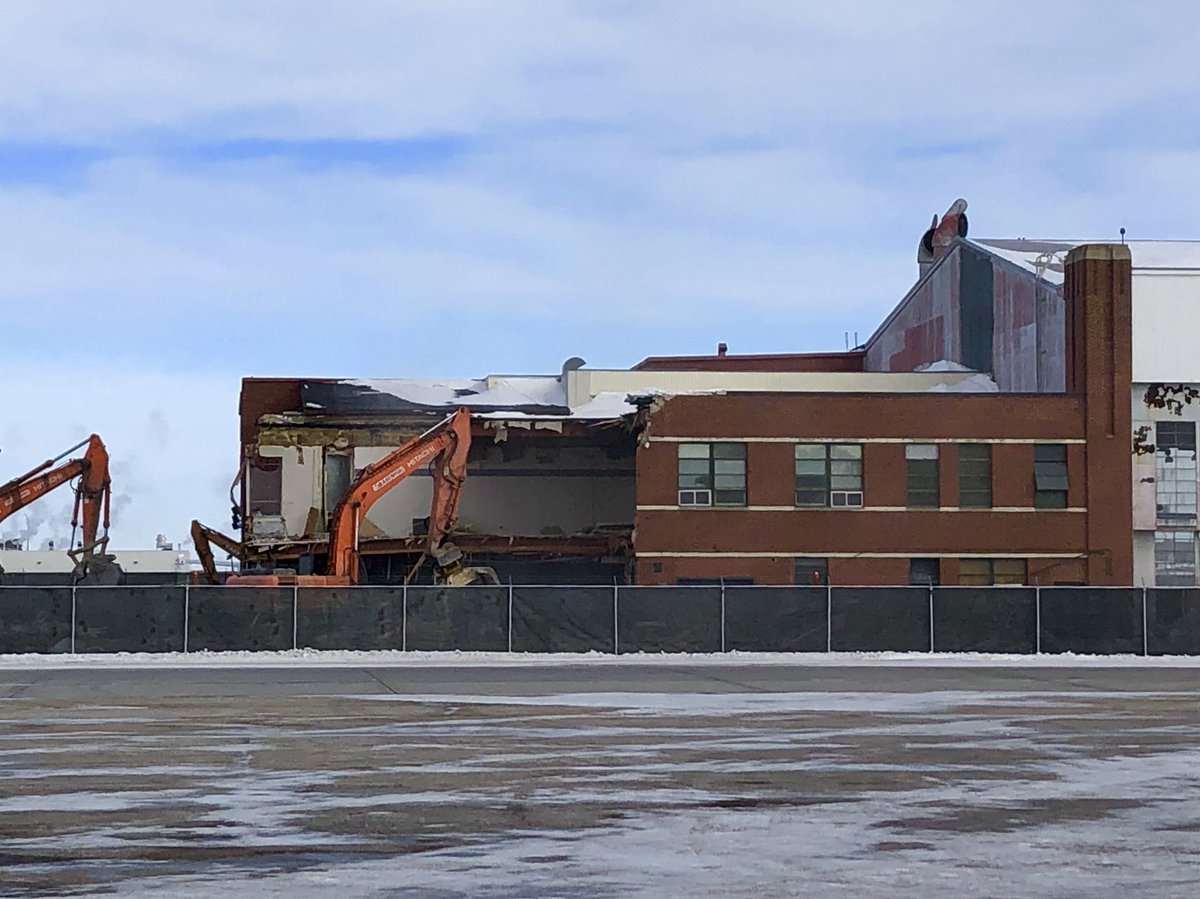 RoderLorne's tweet image. I had a chance to see the demolition of the old site of Royal Aviation Museum of Western Canada (formerly WCAM) from “air side”.  1./ the office space is half gone.  2./ you can see through the building since the Bush Plane Gallery is gone.  3./ Library &amp;amp; Archives is ALL gone.