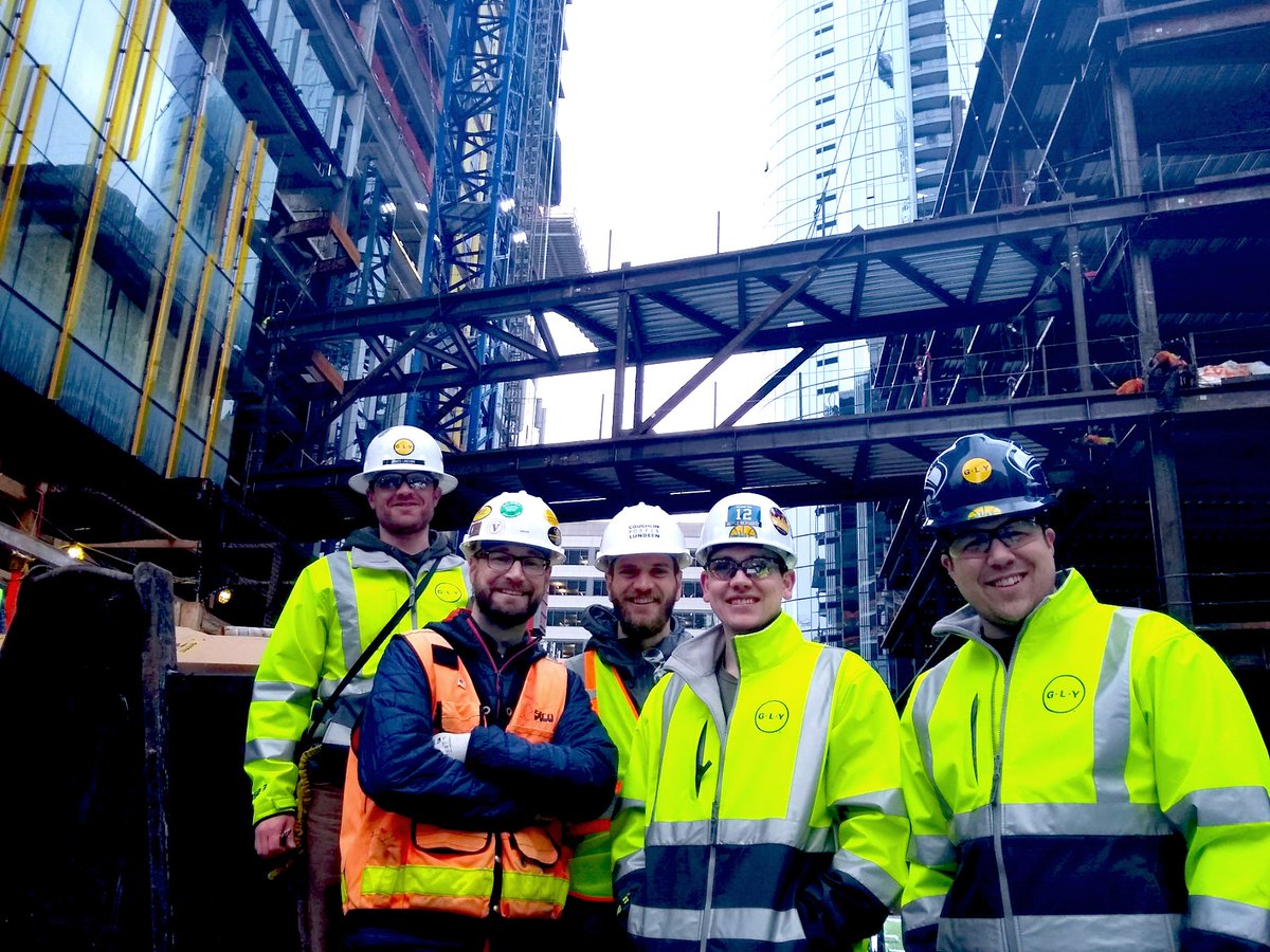 GLYConstruction's tweet photo. Big day at Block 21! Building bridges with Coughlin Porter Lundeen ... quite the sight to see the massive steel connector fly into place! #connectingbridge #structuralsteel @CPL_inc https://t.co/6mne9AVuW6