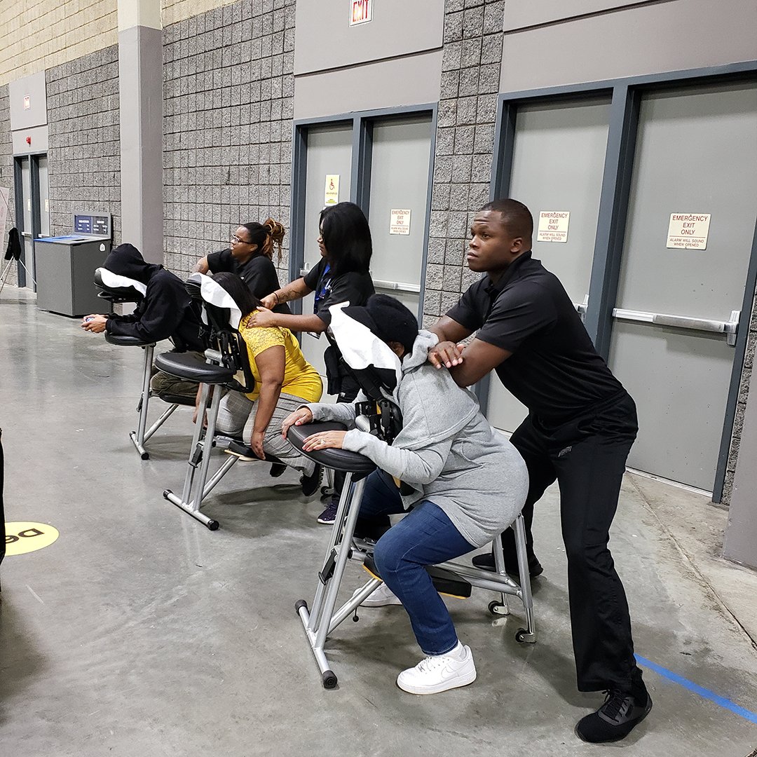SECEducation's tweet photo. Check out these #SoutheasternInstitute Charlotte students lending a hand at the recent @CharMeckSchools Career & Technical Education Career Fair. #SEI Massage & Medical Assisting students demonstrated life skills to potential future graduates #CareerTechnology #MassageTech https://t.co/598DDNwfkl