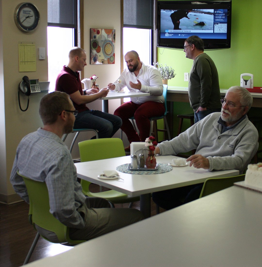 The fearless leader of G&amp;M, Ed Studniski, chose a delicious carrot cake for his birthday treat yesterday. It was so good that two of our Los Angeles coworkers, Daniel Sandoval and Thomas Bartczak, made the trip to chilly MN to sample a piece. Happy Birthday Ed!