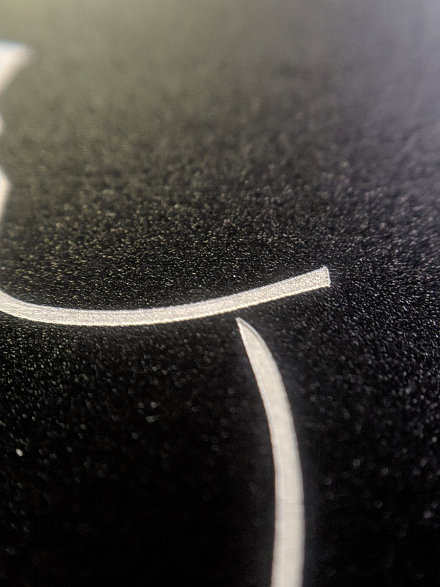 jollygreenegian's tweet photo. The @smartereveryday logo was a great test piece for the fancy new laser I get to play with for a living.  This thing never fails to amaze me with the amount of detail it can achieve.  

Using a macro lens to zoom in and see the individual laser passes is pretty wild. https://t.co/tPEluzfXOM