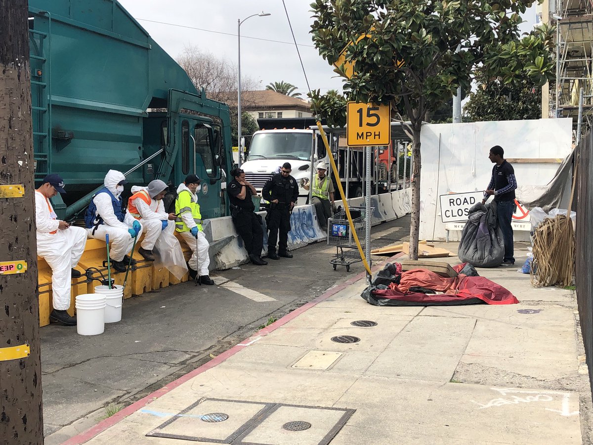 Juggolantern's tweet photo. TODAY in HOLLYWOOD: 10 city employees harass an unhoused man for 20 min demanding he move his clean belongings off the sidewalk. Not because they intended to clean it (they didn’t). They just wanted to erase him from public space. #YouCantEraseUs #StopTheSweeps #StreetWatchLA https://t.co/lI7ZOeTwhu