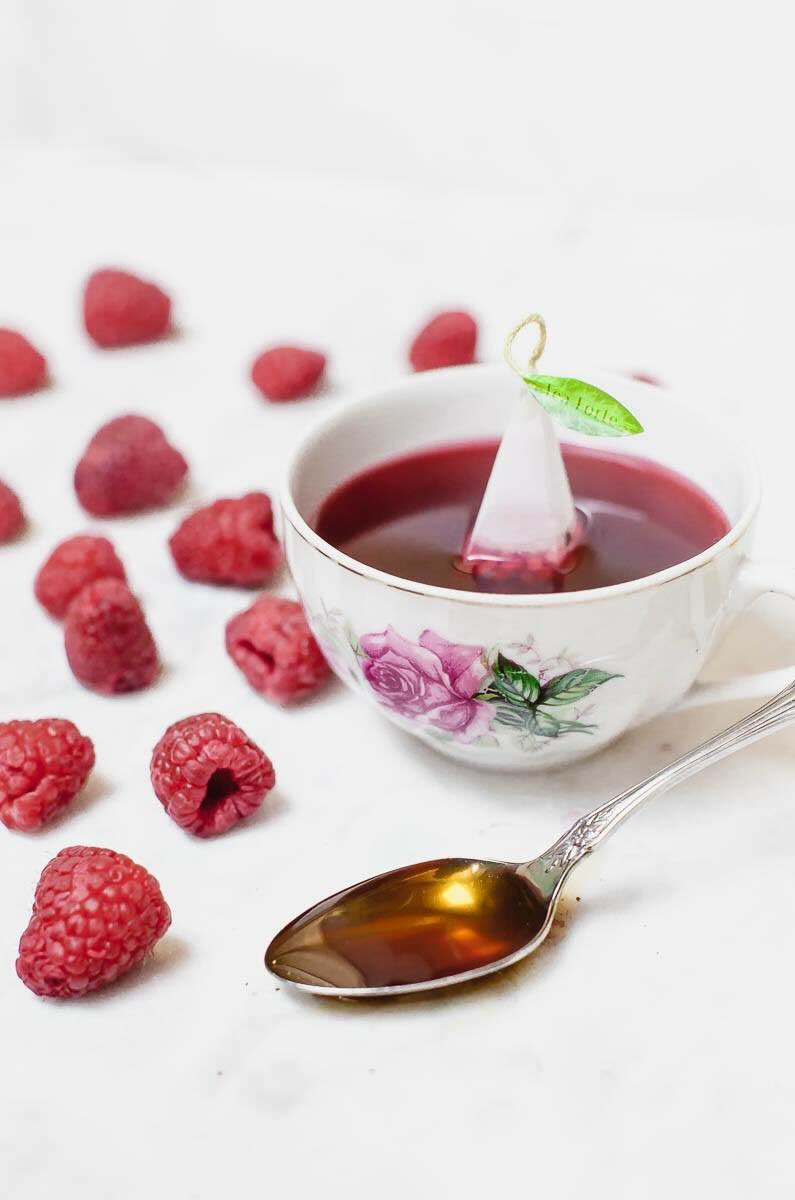 Pinkies up! Shelby gifted me a <a href="/teaforte/">Tea Forté</a> tea assortment box for Christmas, and one of my favorites has been Raspberry Nectar. This light and fruity herbal tea pairs well with White Mountain Apiary honey, as shown on the spoon.