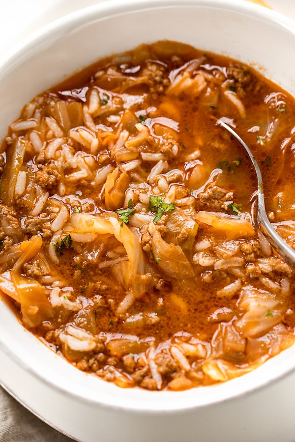 This rich Cabbage Roll Soup is a take on classic cabbage rolls—it’s filled with shredded cabbage, ground beef and rice in a flavorful tomato broth! Grab a spoon &amp; your bowl! thecozyapron.com/cabbage-roll-s…
