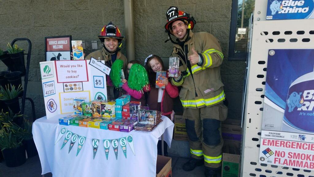 Come on out and visit the Browns Point -Dash Point Firefighters Association raising money for the upcoming stair climb and stop by the Local Girl Scout 
Troop 41311 booth and buy some cookies, too! 

Pictured: Lieutenant Kyle Michaud and Captain Luis Szarko with two Girl Scouts.