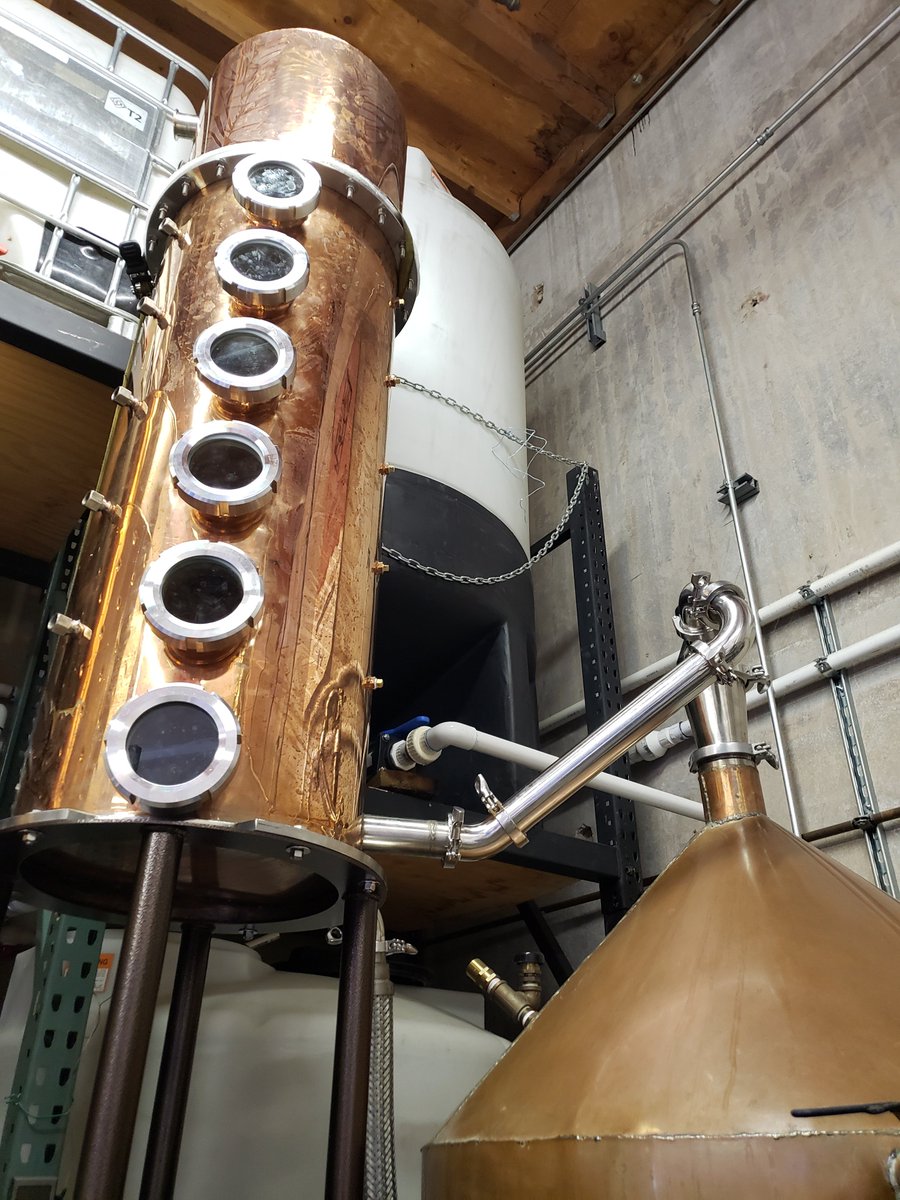 New distillation column and reflux condensor mounted and installed - now we just need to plumb the cooling and product condenser.  #distillation #forkliftsafety #craftspirits #whiskey #reflux #bubblecaps