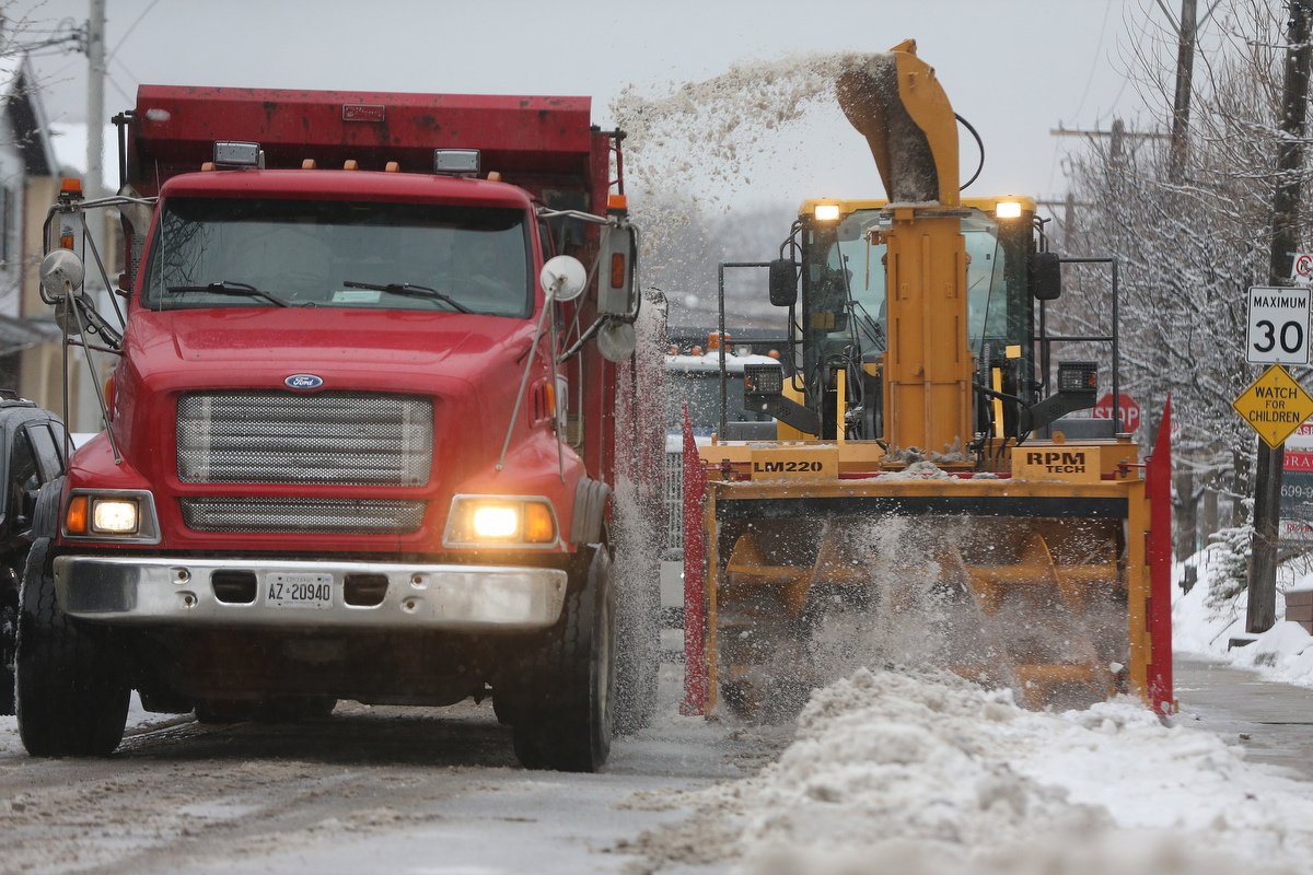 SteveRussell's tweet photo. City of Toronto crews remove snow from streets in the Beaches. Over the weekend the City will be using giant snowblowers and bobcats to remove snow accumulations from streets across the city. #TOwinter #TOsnow #TOstorm https://t.co/68MhB0meht