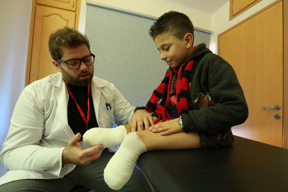ICRC_lb's tweet photo. To the left is how we first met Ahmad in 2015.

To the right is Ahmad now. Can't see him? He's the little boy kicking the green ball and about to score that goal. https://t.co/95GVHaCmiC