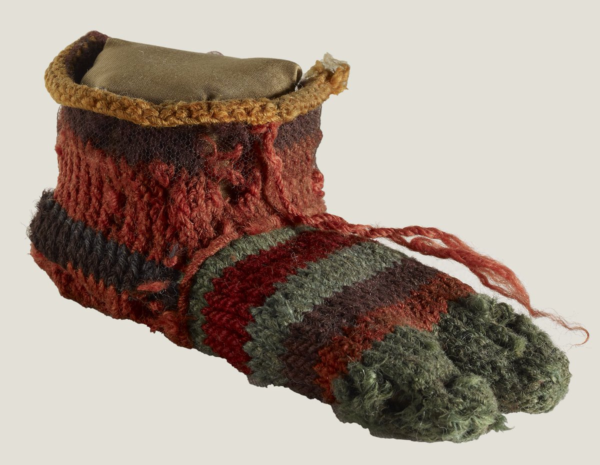 britishmuseum's tweet photo. This child’s striped sock was made in Egypt in the 3rd or 4th century AD. It has two toes so it can be worn with sandals! https://t.co/G7E8zFWBMq https://t.co/3sfTS3MjOW