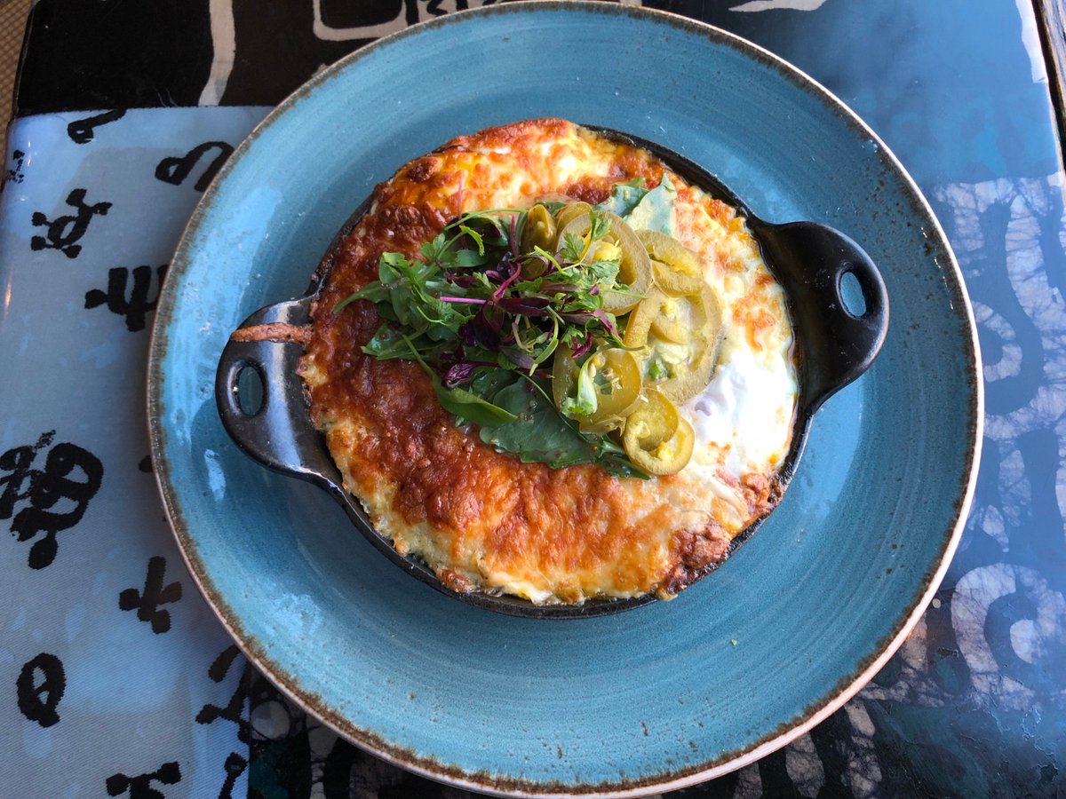 RoosterHarlem's tweet photo. Say hello to Mama's Breakfast Pie - with Korean bbq brisket, creamy potatoes, and baked eggs, this is the Sunday start you need. #redrooster #harlem #Sundaybrunch https://t.co/cFEm3na02V