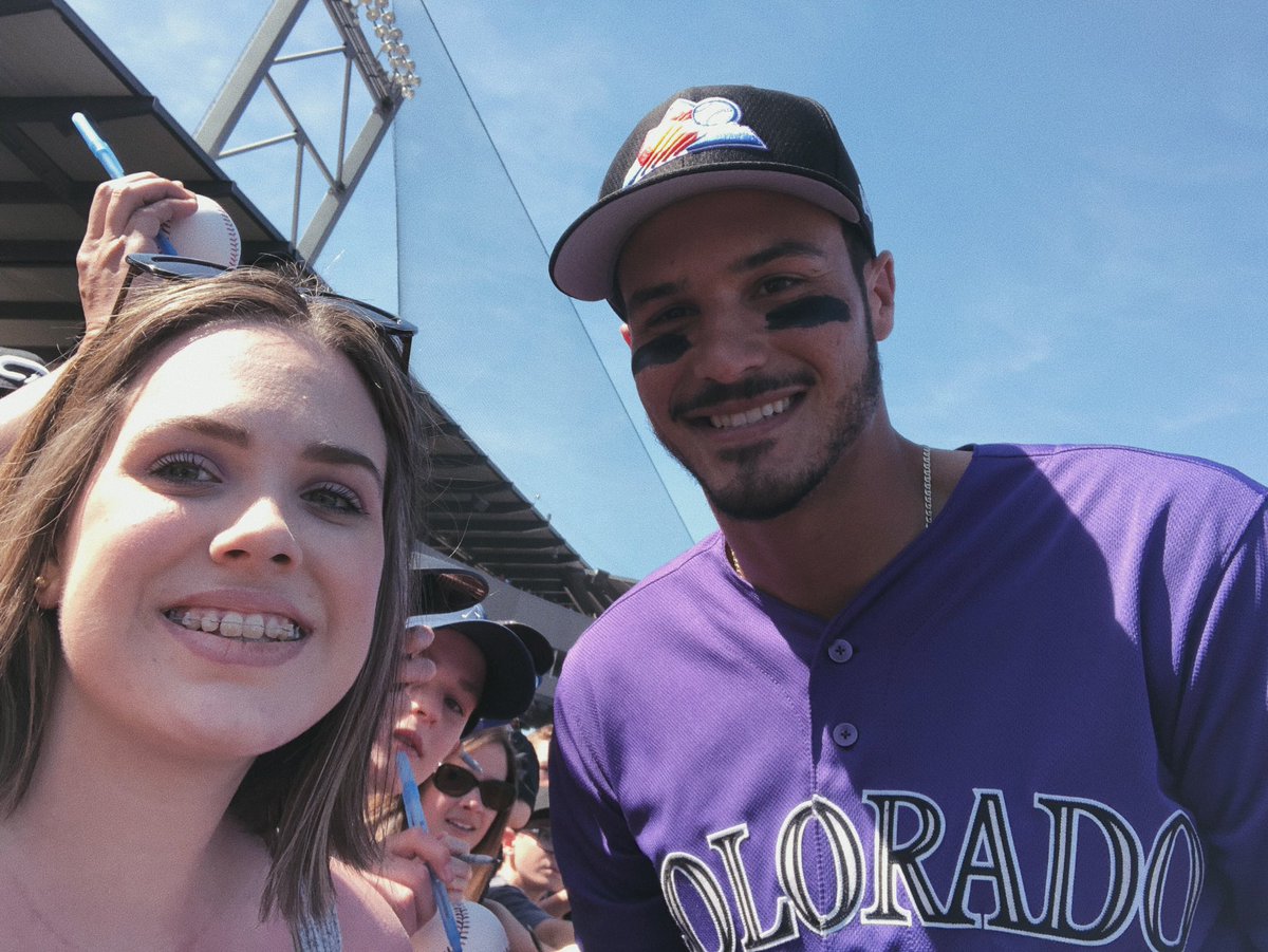 mlbjess's tweet photo. so it happened. i met him. i met my favourite player. nolan arenado. he signed my jersey and took a photo with me. and not only that. i got his home run ball he hit today. today has been the best day. thank you nolan. and thank you @Rockies https://t.co/SCAooWW32C