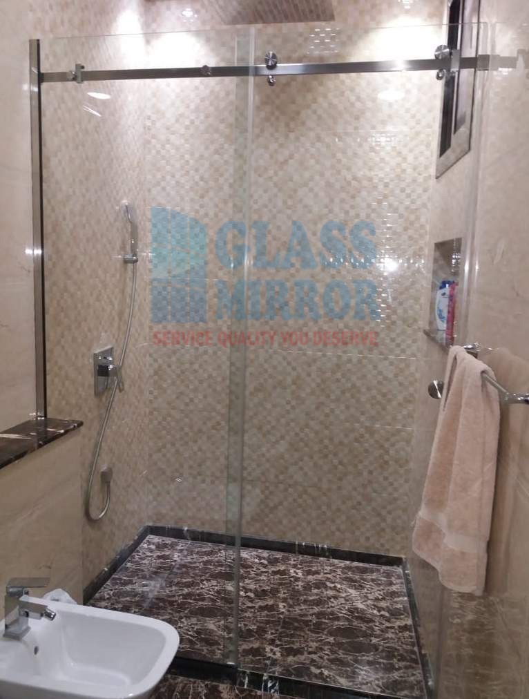 Glass Mirror team Done Work of Shower Enclosure with Sliding Door. Clear Glass Partition. We can make you partition Beautiful with sandblast Sticker Design. #Showerpartition #Showerbathtub #bathroommirror #dubai glassmirror.ae 0588779766