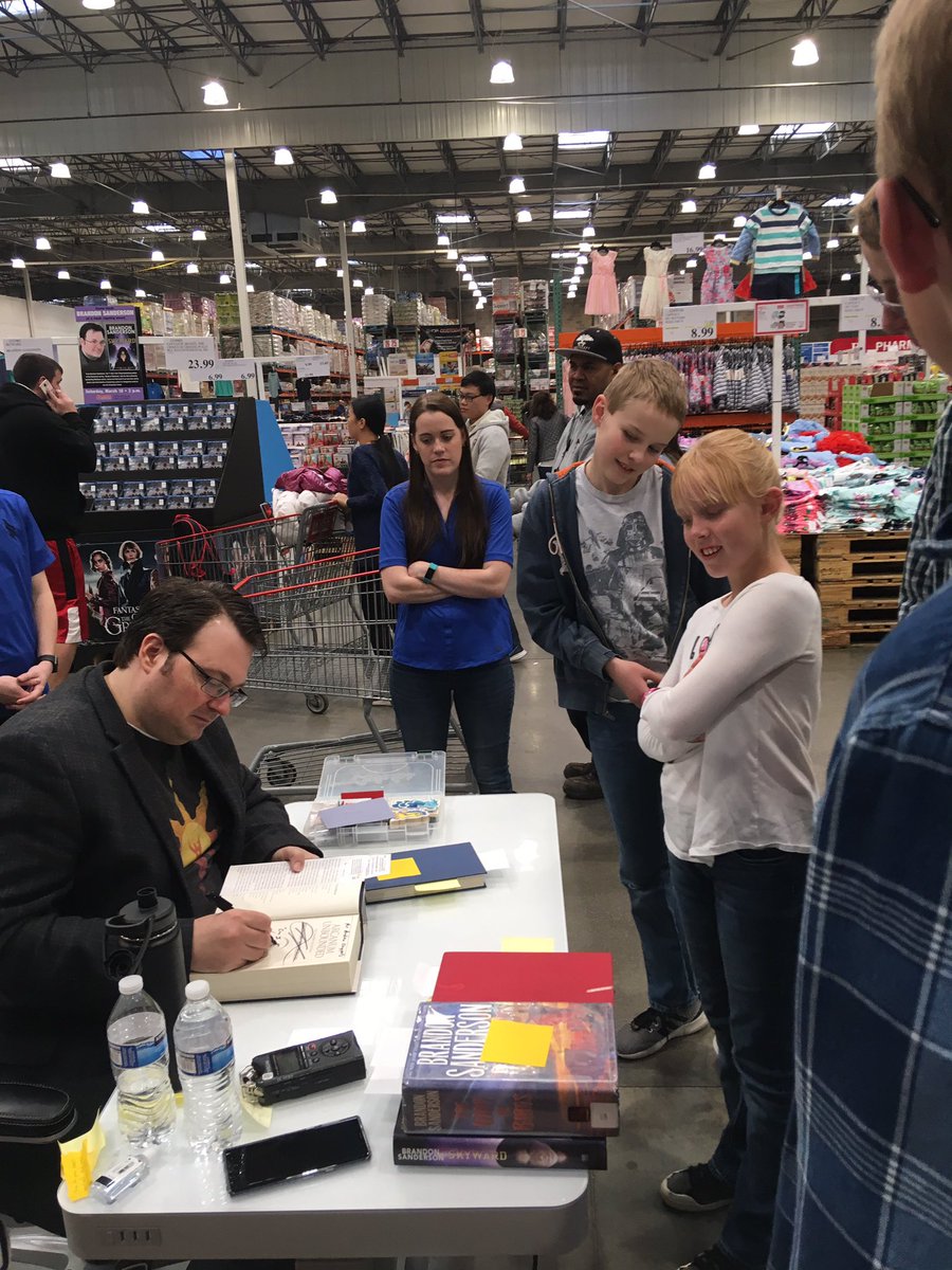 CChappellWCSD's tweet photo. My boys just got to meet their FAVORITE author Brandon Sanderson (at Costco!) He autographed a stack of their well-read books and said, “Thanks for reading! It makes it possible for me to write what I love.” #wasatchreads ❤️📚 https://t.co/lBCPsS6LfK