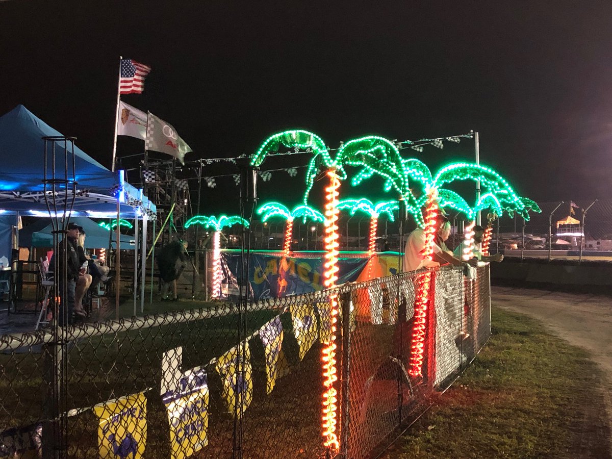 DavidTibbitt's tweet photo. #Sebring12 fans at the hairpin and LED Palm Trees loving the #IMSA action! https://t.co/CZdS2Iu2IR