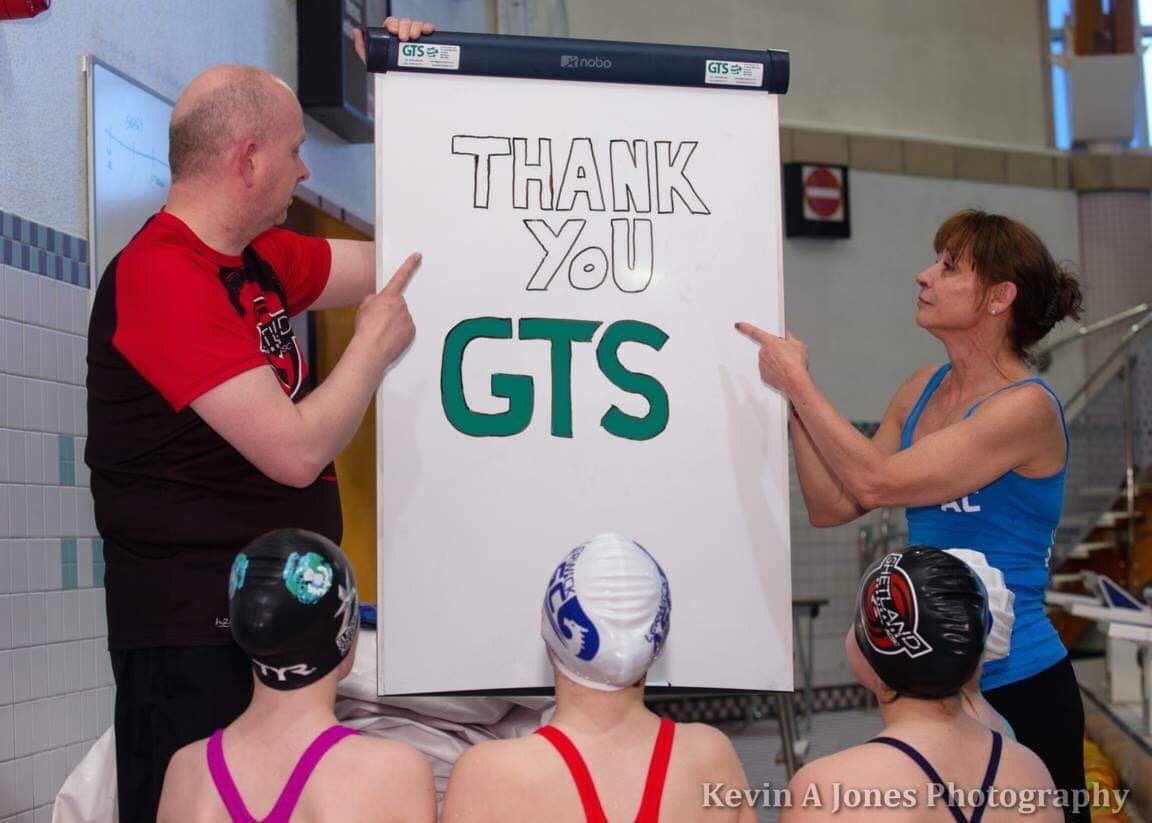 Head coaches of Shetland (Hurricanes) ACSC Pétur Pétursson and Lerwick ASC Alba Collins with the new portable NOBO white board for use by swimming coaches in various locations around the Clickimin pool generously donated by local Office Supplies &amp; IT Equipment providers <a href="/GTS/">֎</a>