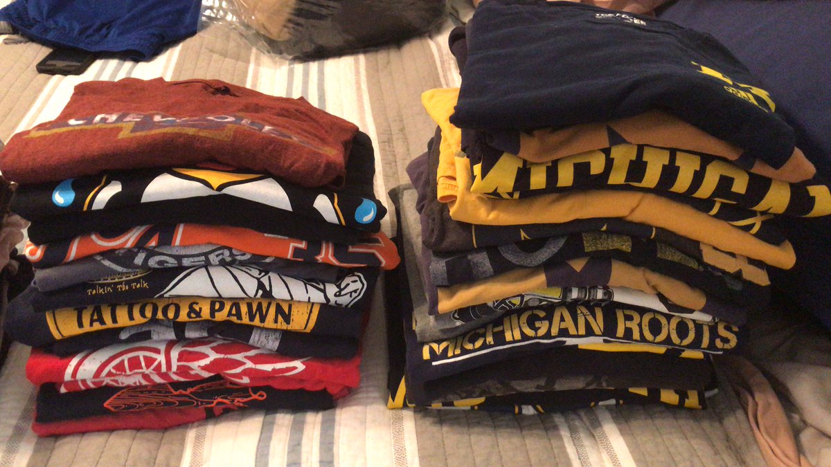 kjnsmom's tweet photo. My husband could wear a different Michigan related T-shirt everyday for 28 days, UMich, Red Wings, Tigers, GM, & Chevy. And this doesnโt even include the stack of other random T-shirtโs. #addiction #somanyclothes https://t.co/DgPJv7FYkJ