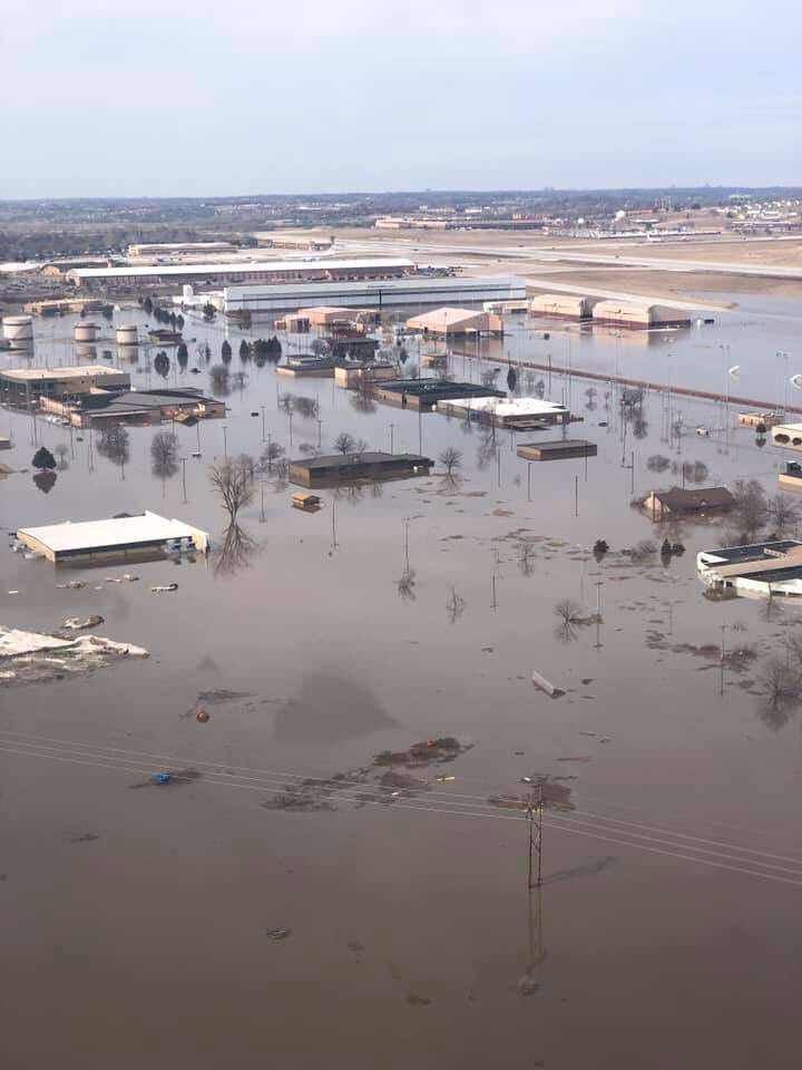 GFAFBCommander's tweet photo. The @319ABW Warriors of the North are thinking about our fellow Airmen of the Fightin’ 55th at Offutt AFB, just south of Omaha, NE.  A large part of the base is currently underwater due to massive flooding. Waters should recede later this week.  Please keep them in your thoughts. https://t.co/0khgchuS72